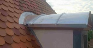 Lucarne cintree en joint debout avec tuile plate alsacienne